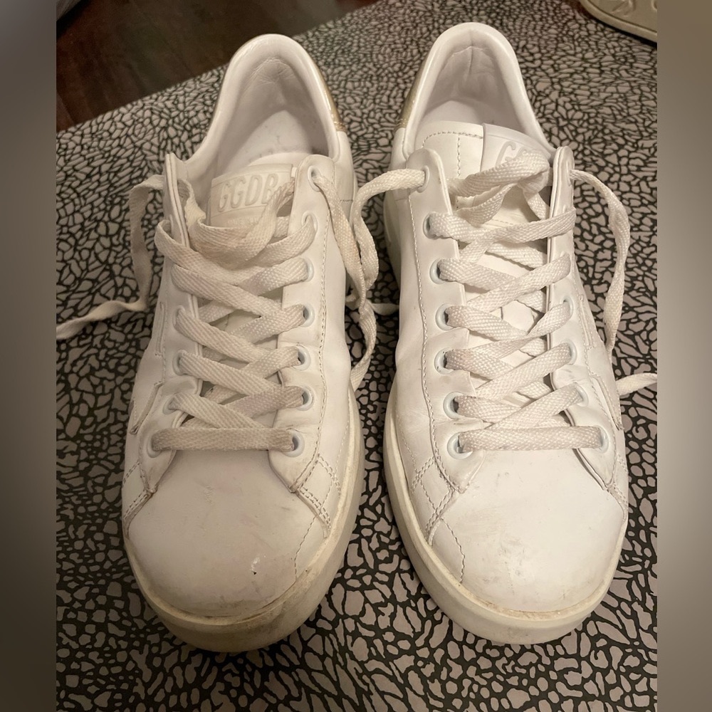 White golden goose sneaker with gold back. Lightly worn